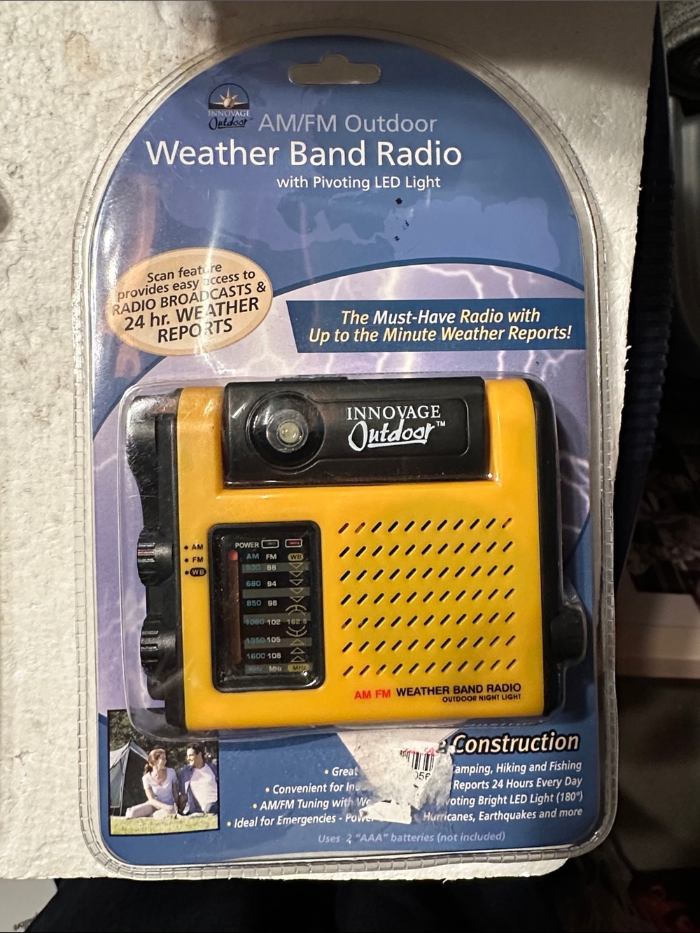 Vintage AM/FM outdoor weather band radio with pivoting LED light